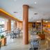 Posadas De España Cartagena dining area with tables, chairs, and buffet counter in Cartagena