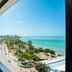 Hotel Sete Coqueiros, Maceió, with oceanfront balcony view of beach, palm trees and turquoise water