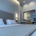Palladion Boutique Hotel in Árgos guest room with bed, desk, and modern lighting