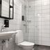 Stadshotellet Kristinehamn bathroom with shower, toilet and sink in Kristinehamn