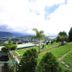 Ashley Resort in Nuwara Eliya with a lush hillside lawn and scenic valley view