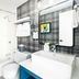Gravity Haus Steamboat bathroom with shower-tub, vanity, and plaid accent wall in Steamboat Springs