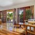 Portofino Beach Resort in San Pedro Town: airy guest room with balcony doors and tropical garden view