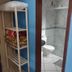 Pousada Mar de Araçatiba bathroom with shower, toilet and shelf with towels in Vila do Abraao