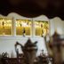 Hudson Manor Bed & Breakfast in Watkins Glen with stained-glass window above antique tea service
