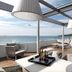 Hotel Garbi Ibiza & Spa in Sant Jordi de ses Salines rooftop terrace with sea view and lounge seating