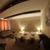 Euro Hotels Drzonków guest room with double bed, sofa, and warm ambient lighting