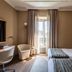 Worldhotel Cristoforo Colombo Milan guest room with twin beds, desk, and balcony doors