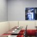 Hôtel de France Boulogne-Billancourt dining area with red seating, tables set for two, and wall art