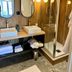 Hôtel Le Yachtman, La Rochelle bathroom with double sinks, mirrors and glass shower