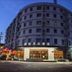 Yangjianhua Hotel (Shanghai Hu'nan) in Shanghai, exterior corner view at dusk on a city street