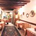 Art Palace - Residenza Giardini in Venice, cozy dining room with tables, chairs, patterned rug and wooden beams
