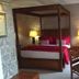 Hardwicke Hall Manor Hotel in Hartlepool: four-poster bed, desk, and bedside lamps in a guest room