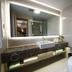 Jinhu Hotel Wuxi bathroom with wall mirror, vessel sink, and modern toilet