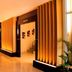 Grand Daira Hotel Palembang lobby with warm wood slat lighting and polished floors in Palembang
