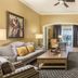 Club Wyndham Nashville living room with sofa, armchairs, coffee table, wall TV and city view