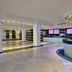 Sol Milanos Pingüinos lobby with curved reception desk, spiral staircase and modern open interior in Son Bou