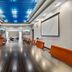 Holiday Inn Express & Suites Lakeland South meeting room in Lakeland with long conference table and blue-lit ceiling