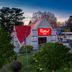Red Roof Inn Warrenton in Warrenton exterior with red-roofed entrance and parking area at dusk