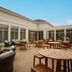 Hilton Garden Inn Auburn courtyard patio with outdoor seating and tables in Auburn