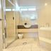 Bathroom at The Wyndhamere Motel Shepparton with shower, sink vanity and bathtub