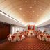 Hotel Estelar de La Feria Bogotá banquet hall with round tables and warm ceiling lights