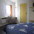 Hôtel Noctuel Blois Sud room in Saint-Gervais-la-Forêt with bed, desk, window and wall-mounted TV
