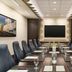 Hilton Motif Seattle meeting room with long conference table and wall-mounted screen