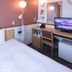 Toyoko Inn Shizuoka Fujieda eki Kita guchi room with bed, desk, TV and mini fridge in Fujieda