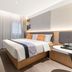 Home Inn Style Shanghai Railway Station Zhongxing Road Metro Station room with bed, TV and curtains in Shanghai