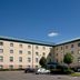 Premier Inn Thurrock West in West Thurrock exterior with parking and blue sky
