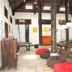 Some Days Of Silence Resort And Spa in Dong Hai: airy rustic lounge with wood beams, bean bags and long tables