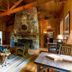The Lodge on Lake Lure in Lake Lure features a rustic lounge with stone fireplace and chandelier