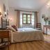 Alesga Rural room in San Martín de Teverga with twin beds, wood floors, window and small writing desk