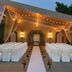 Outdoor wedding setup at Hilton Scottsdale Resort & Villas in Scottsdale with white chairs and string lights