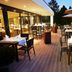 Fletcher Hotel-Restaurant De Buunderkamp terrace dining area in Wolfheze with outdoor tables and umbrellas