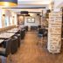 The Manor House Hotel in Dronfield restaurant with stone pillars, leather seating and bar stools