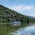 Quinta Nova Winery House - Relais & Châteaux in Covas do Douro, riverboat on calm Douro River