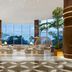 The Westin Playa Bonita Panama lobby with ocean view, palm trees, and lounge seating in Playa Bonita Village