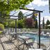 Campanile Troyes Nord - Barberey outdoor poolside terrace with tables and lounge chairs