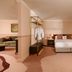 Milton Park Country House Hotel & Spa room in Bowral with king bed, lounge area and full-length mirror
