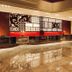 Millennium Hotel Sirih Jakarta lobby with glossy marble floor and red seating in Jakarta