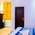 Hotel Ashoka Palace Near Igi Airport, New Delhi guest room with bed and bright window