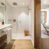Es Figueral Nou Hotel Rural & Spa - Adults Only bathroom with walk-in shower and wood vanity in Montuïri
