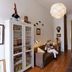 Alvares Cabral Guest House in Porto lobby with sofa, display cabinets, and wood floors
