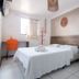 Hotel Gogó da Ema in Maceió, simple guest room with bed, desk, chair and wall mirror