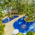 Best Western Premier Bangtao Beach Resort & Spa in Choeng Thale with a tropical lagoon-style pool and palm trees