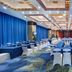 The Greenway Hotel Xiamen meeting hall in Xiamen with blue drapes, banquet tables, and patterned carpet