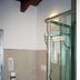 Hotel La Rosta in Reggio nell'Emilia bathroom with bidet, toilet and glass shower stall