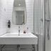 ibis Styles Paris Eiffel Cambronne bathroom with sink, mirror, and glass shower in Paris
